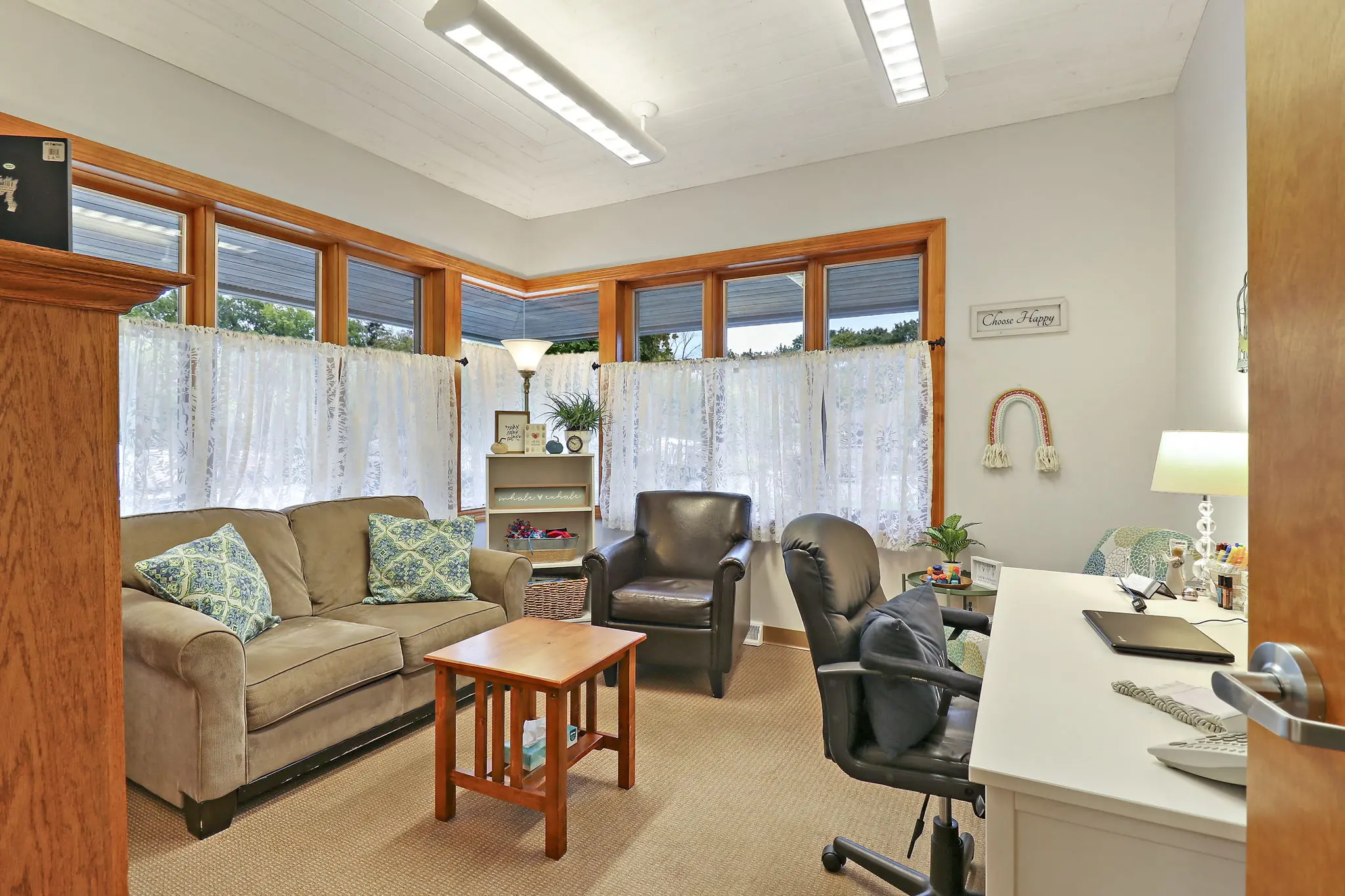 calming office therapy couch with windows and drapes