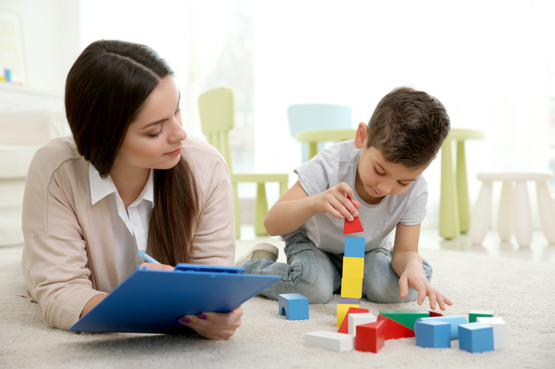Child in Therapy building with blocks