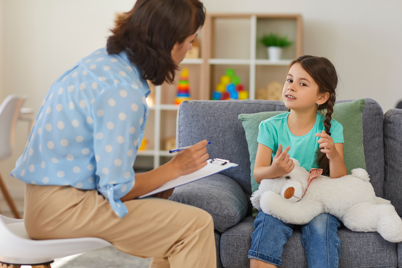 Child in Therapy with stuffed bear