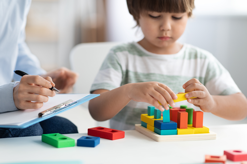 Child in counseling building blocks